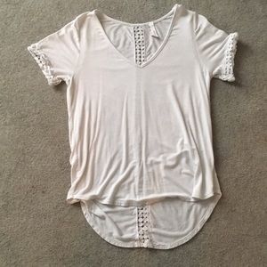 White blouse with cut out designs on sleeves/back